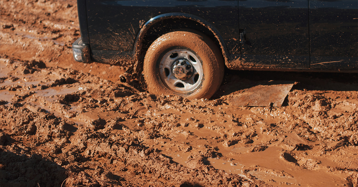 car stuck in mud pit